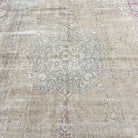 1970s beige vintage Turkish persian rug with medallion design, hand-knotted weave and low pile.