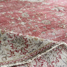 Red 9' x 11' vintage Turkish persian rug in wool and cotton, shown on the floor.