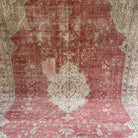 1970s red vintage Turkish persian rug with medallion design, hand-knotted weave and low pile.