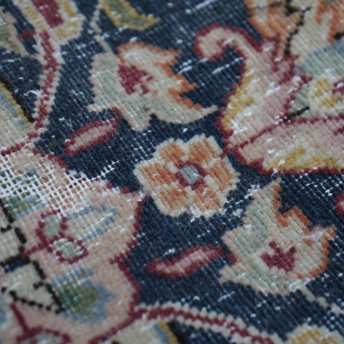 Additional view of the red vintage persian rug, hand-knotted in wool and cotton.