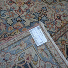 9' x 12' red vintage persian rug with hand-knotted weave and low pile.