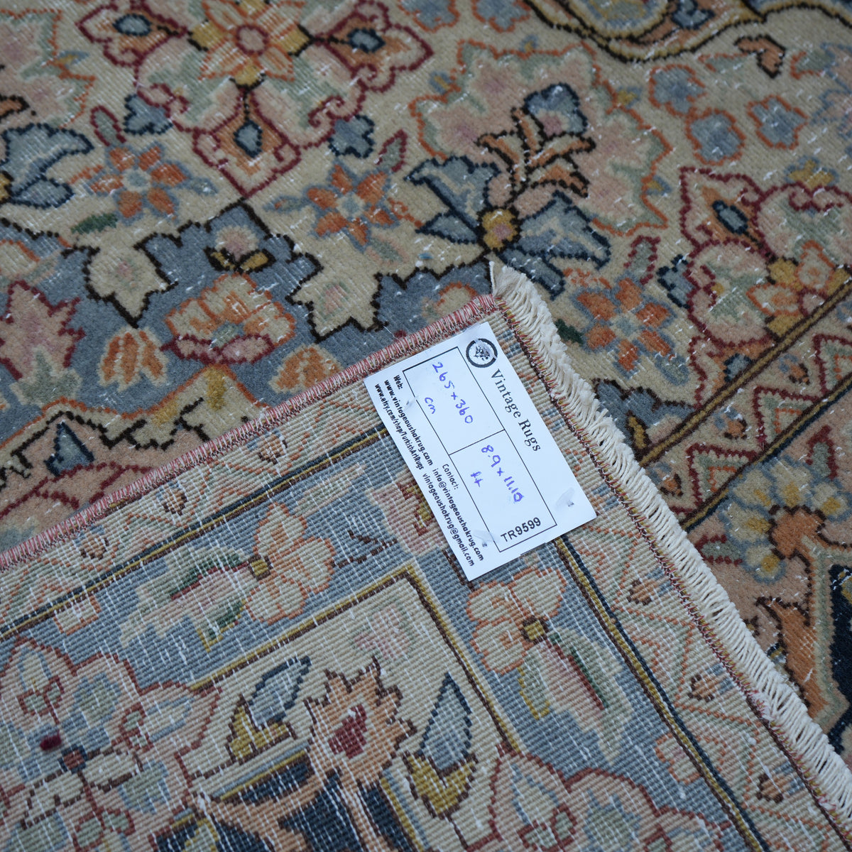 9' x 12' red vintage persian rug with hand-knotted weave and low pile.