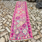 Pink 3' x 10' vintage persian runner rug in wool and cotton, shown on the floor.