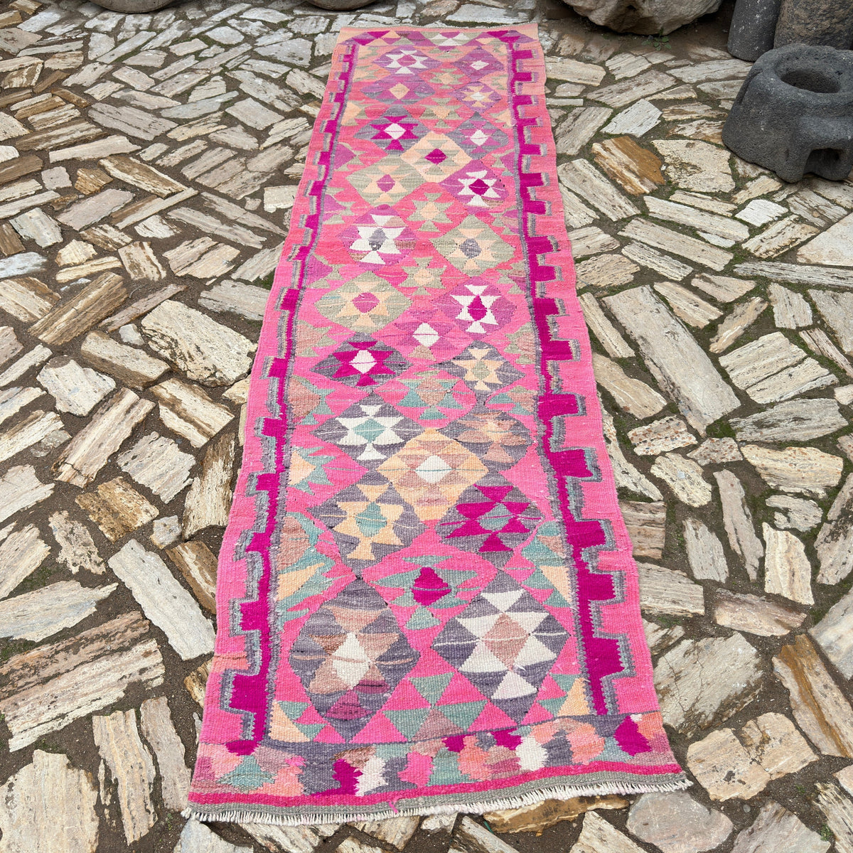 Pink 3' x 10' vintage persian runner rug in wool and cotton, shown on the floor.