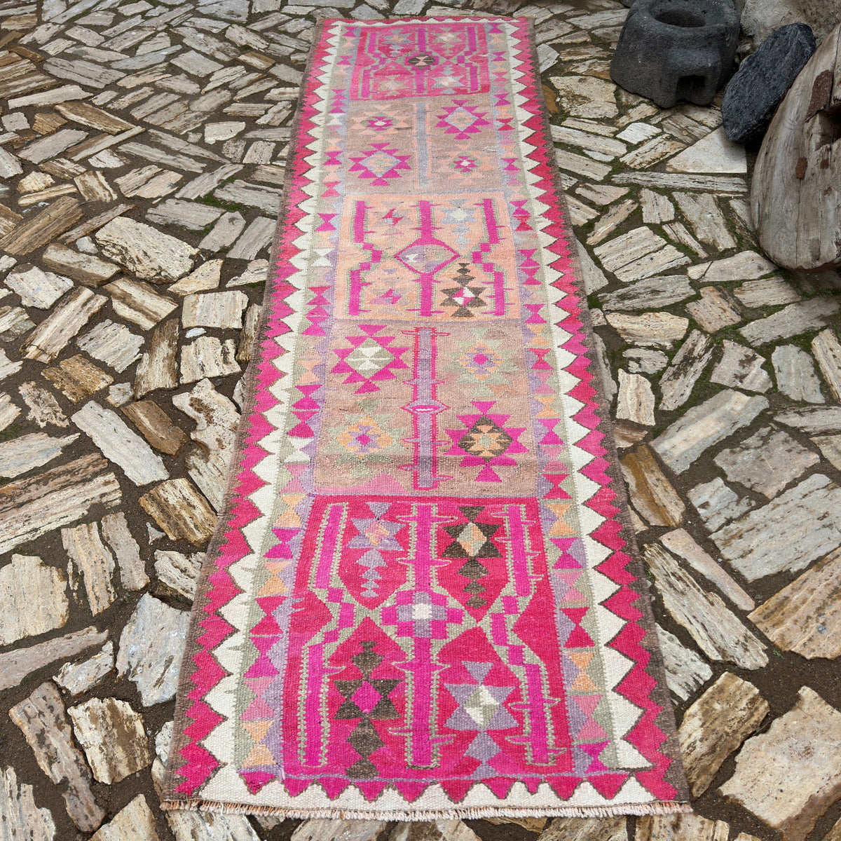 Pink 3' x 11' vintage persian runner rug in wool and cotton, shown on the floor.