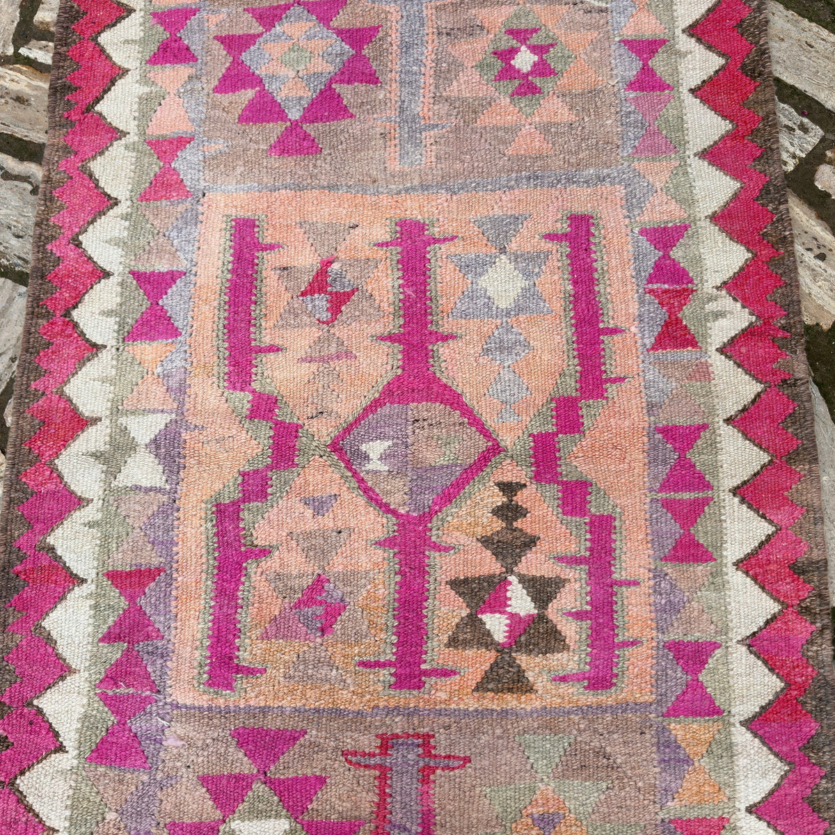 1970s pink vintage persian runner rug with traditional design, hand-knotted weave and low pile.