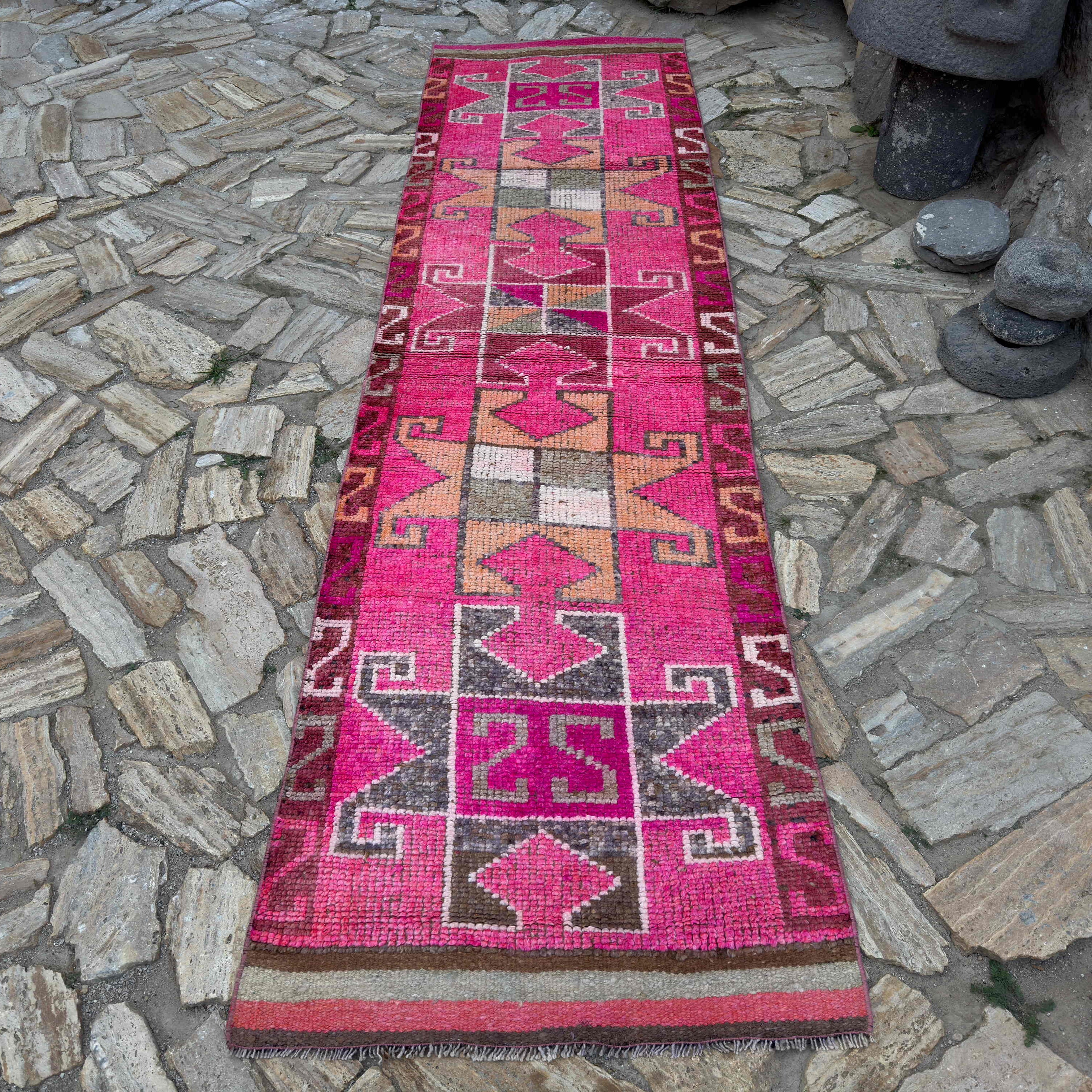 Pink 3' x 11' vintage persian runner rug in wool and cotton, shown on the floor.