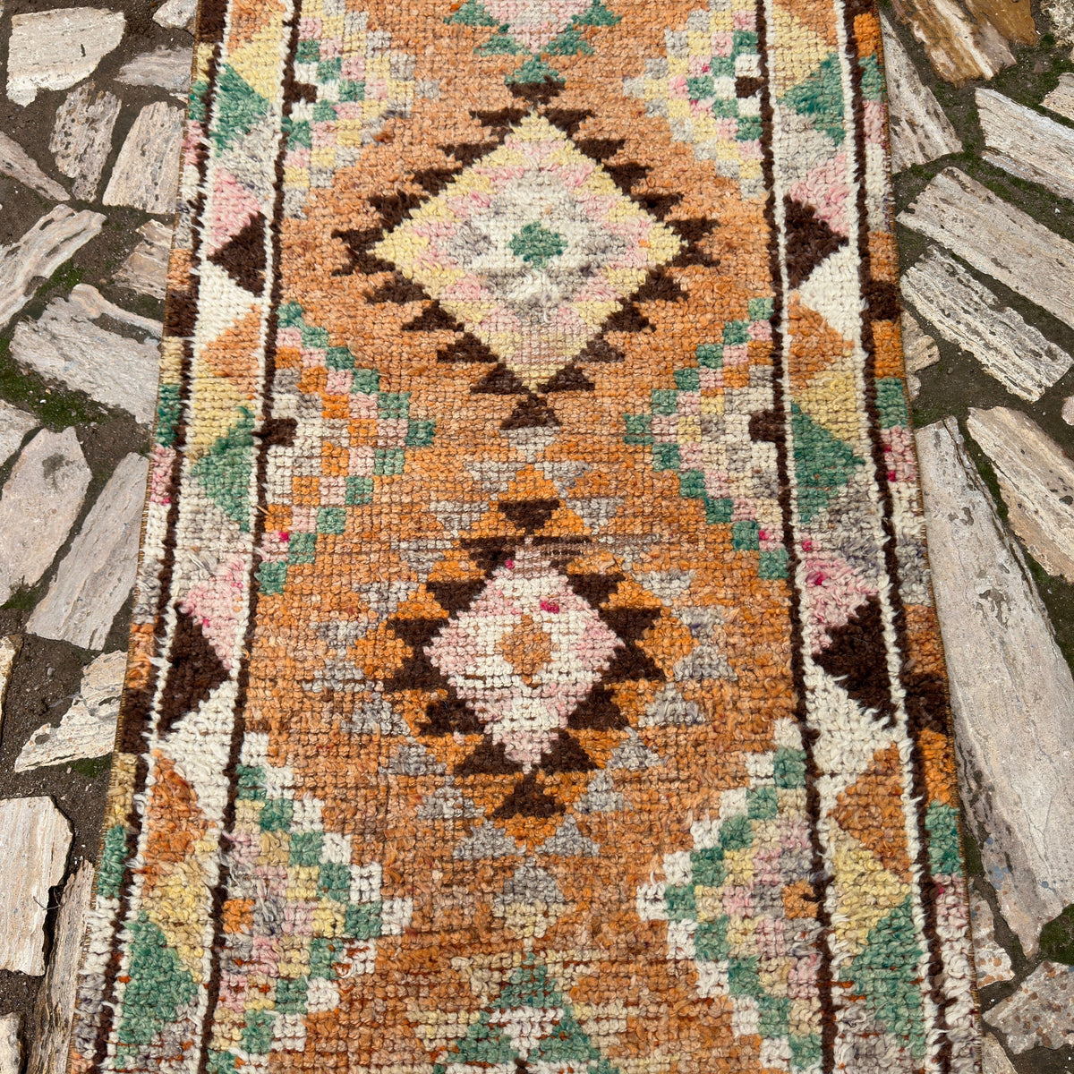 1970s orange vintage persian runner rug with traditional design, hand-knotted weave and medium pile.