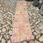 Pale Orange 3' x 12' vintage persian runner rug in wool and cotton, shown on the floor.