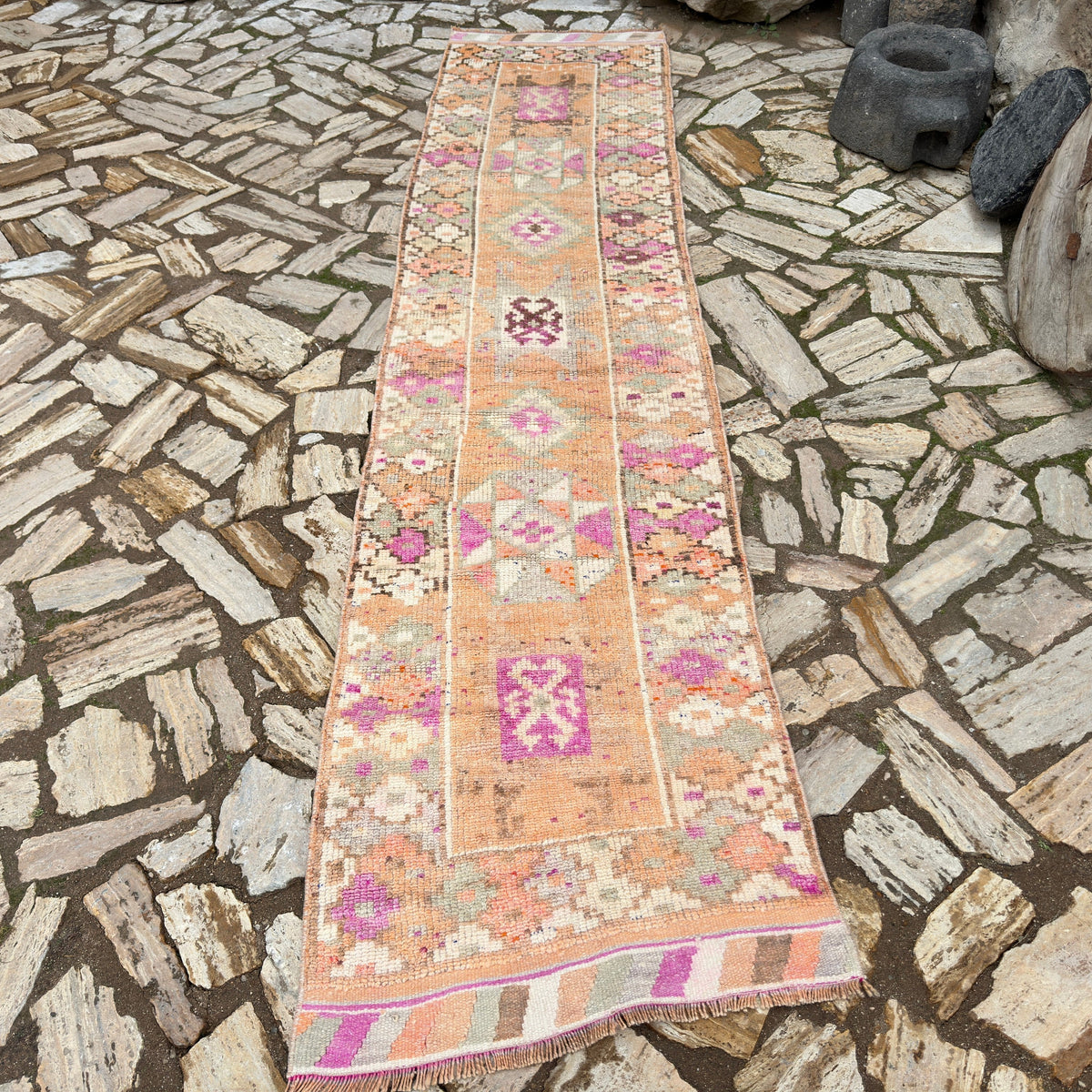 Pale Orange 3' x 12' vintage persian runner rug in wool and cotton, shown on the floor.