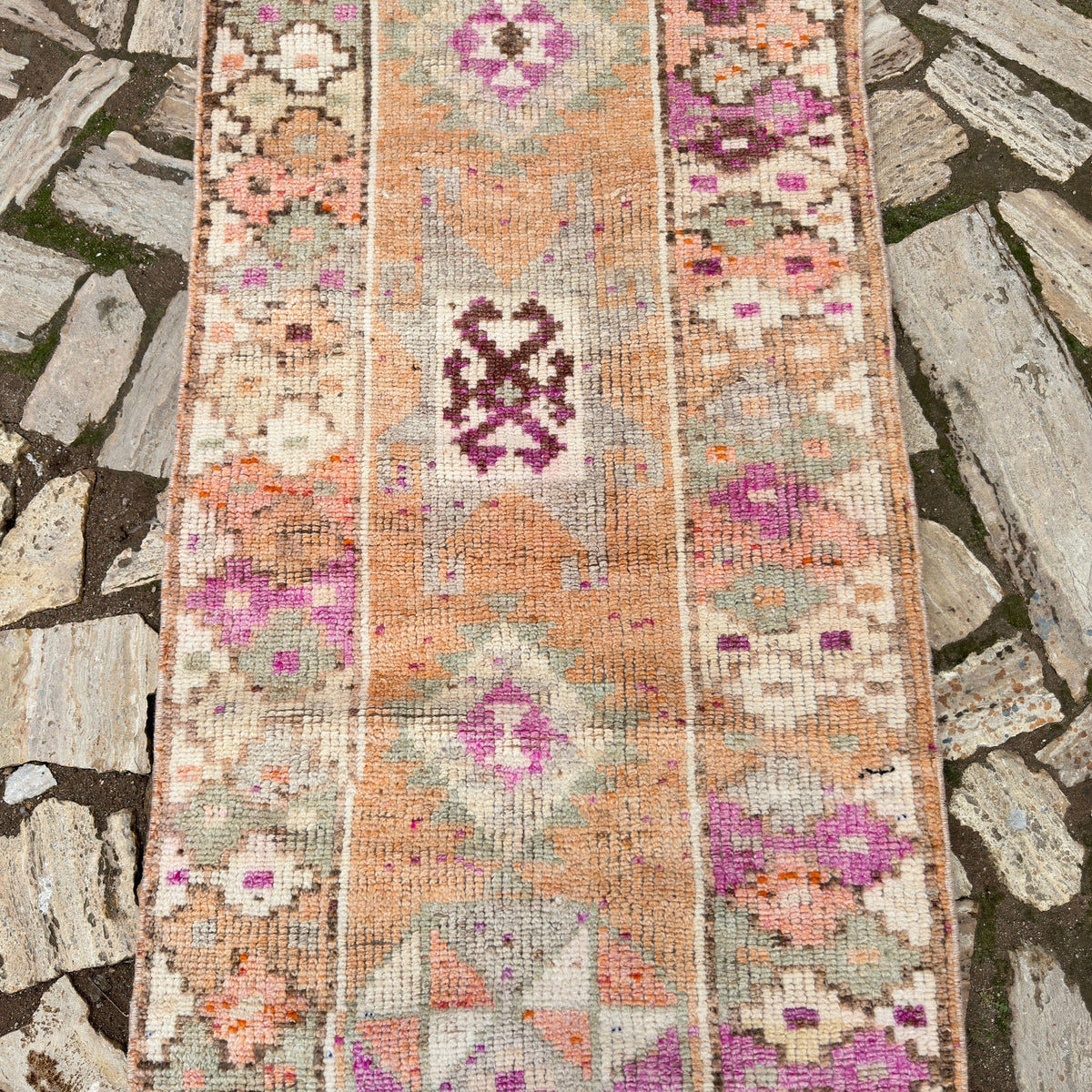 1970s pale orange vintage persian runner rug with traditional design, flatweave construction and low pile.