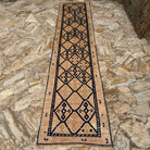 Pale Orange 3' x 12' vintage persian runner rug in wool, shown on the floor.