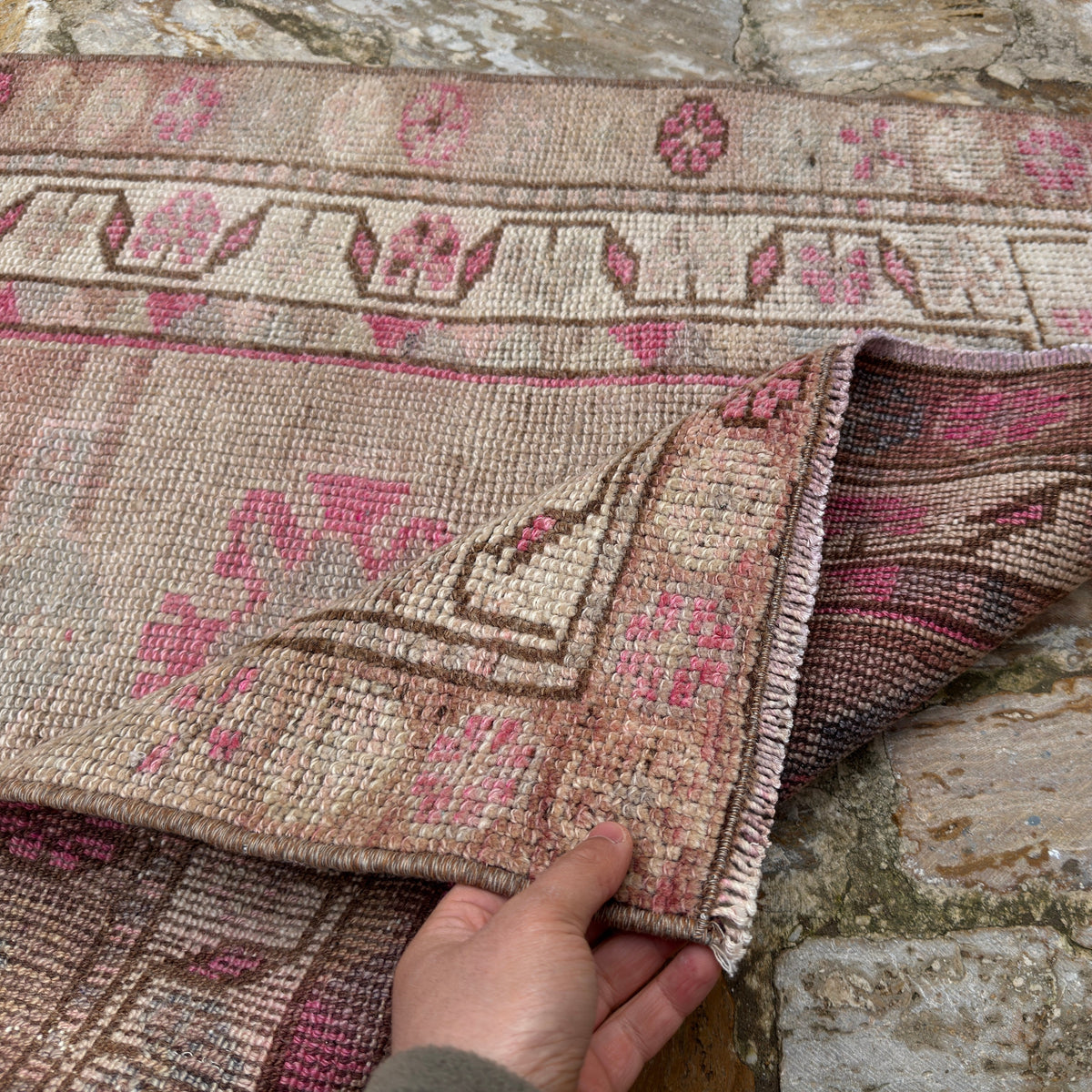 1970s pink vintage persian runner rug with traditional design, hand-knotted weave and low pile.