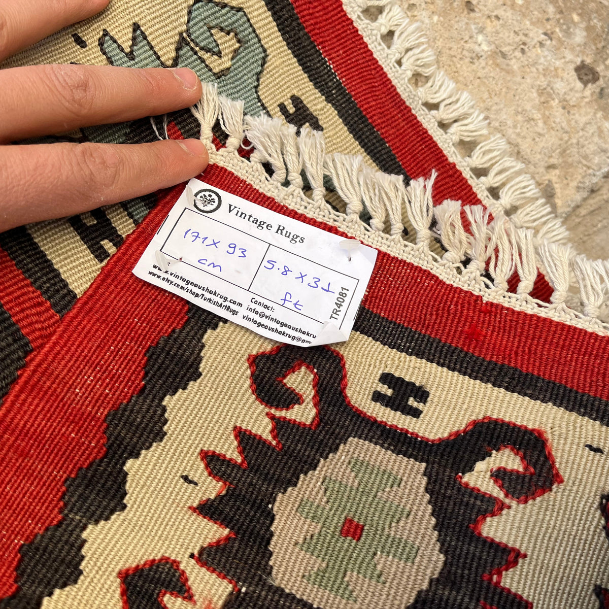 Red 3' x 6' vintage Turkish persian runner rug in wool and cotton, shown on the floor.