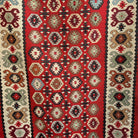 1970s red vintage Turkish persian runner rug with traditional design, flatweave construction and low pile.