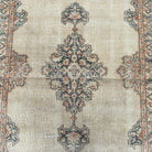 1970s beige vintage Turkish persian style rug with medallion design, hand-knotted weave and low pile.