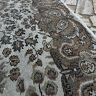 Close-up of the brown vintage Turkish persian style rug showing geometric details, hand-knotted weave, wool and cotton and low pile.