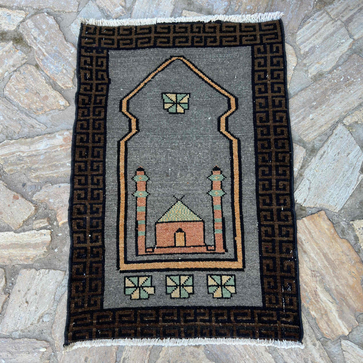 Gray 2' x 3' vintage Turkish prayer rug in wool and cotton, shown on the floor.