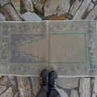 1970s beige vintage Turkish prayer rug with traditional design, hand-knotted weave and low pile.