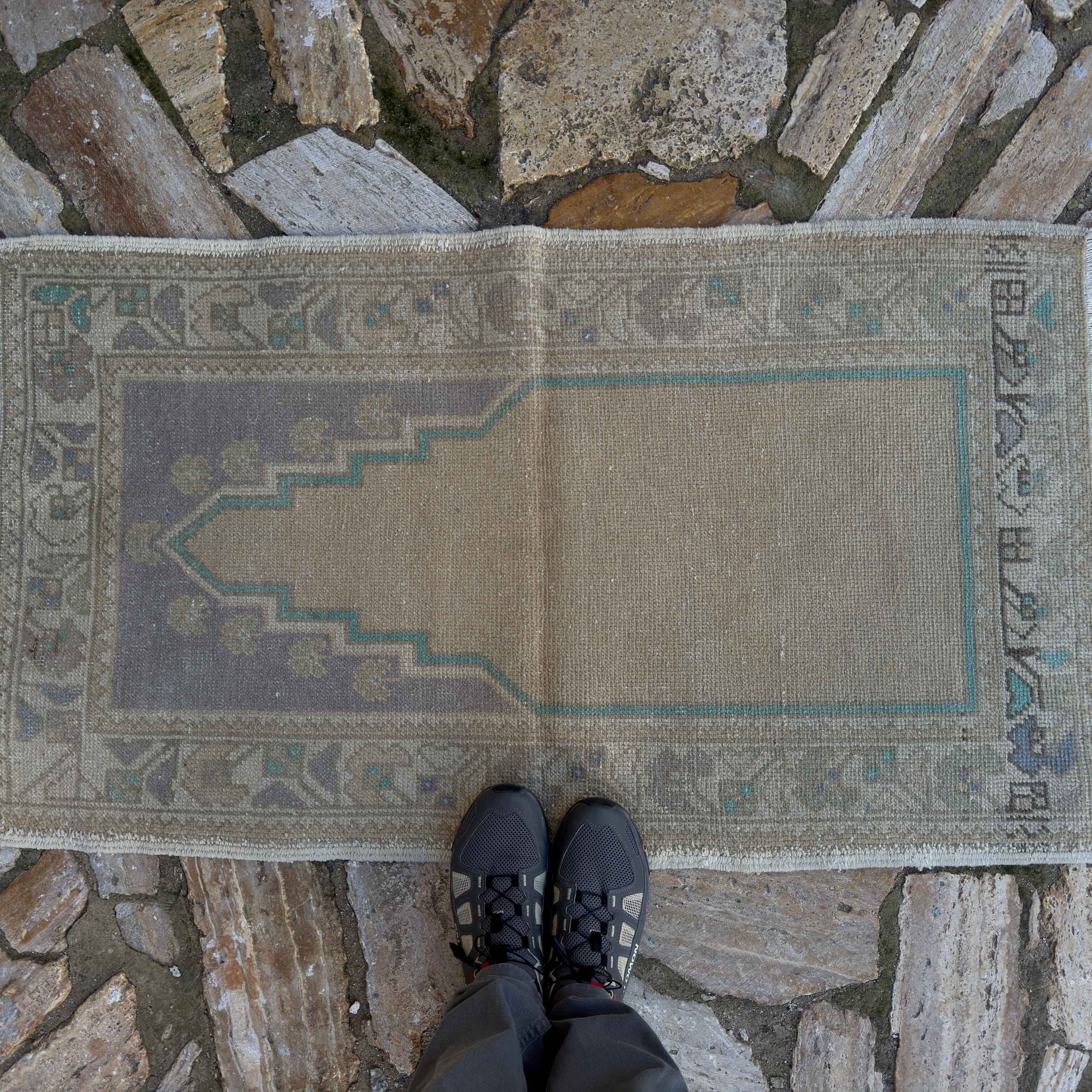 1970s beige vintage Turkish prayer rug with traditional design, hand-knotted weave and low pile.