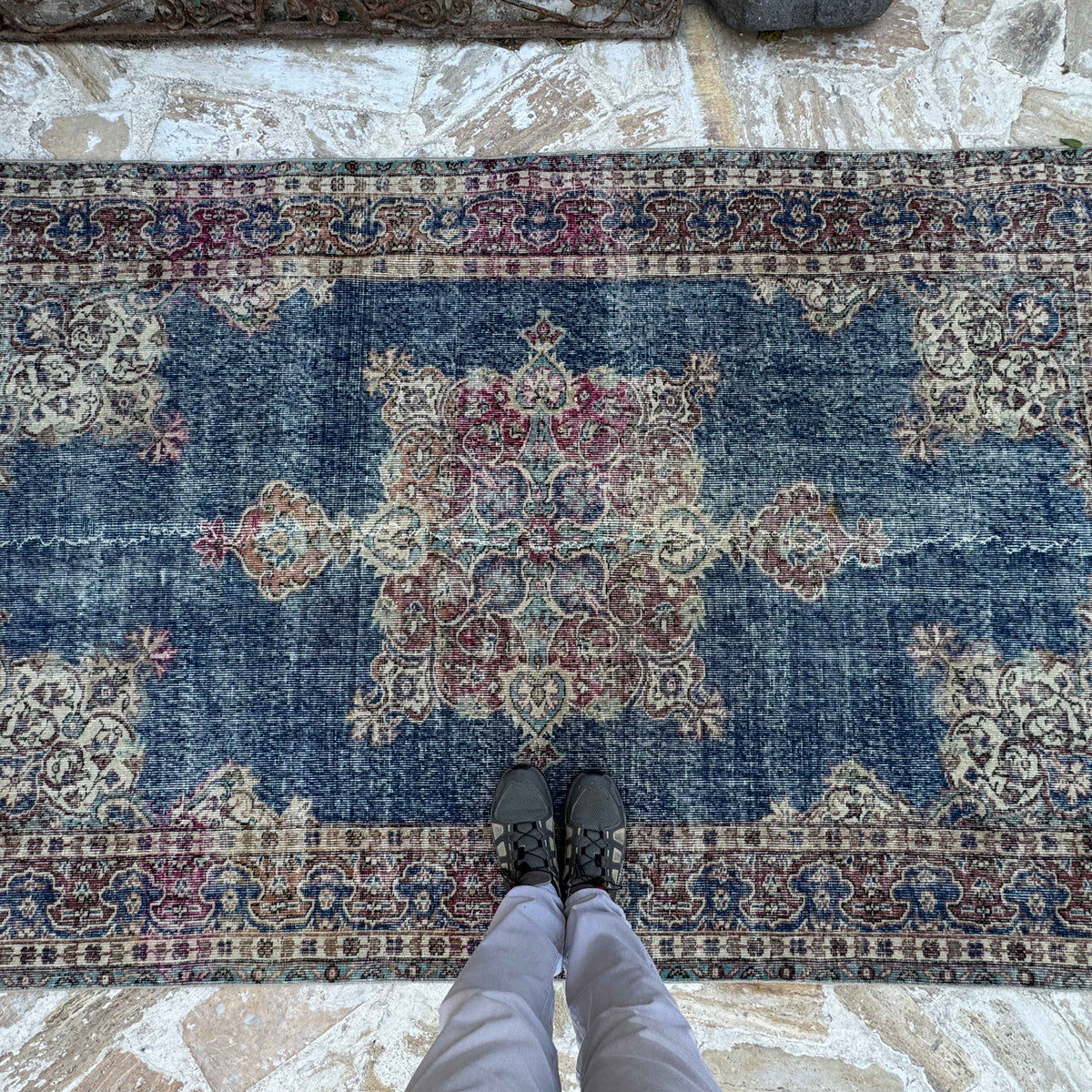 1970s blue vintage Turkish rug with medallion design, hand-knotted weave and low pile.
