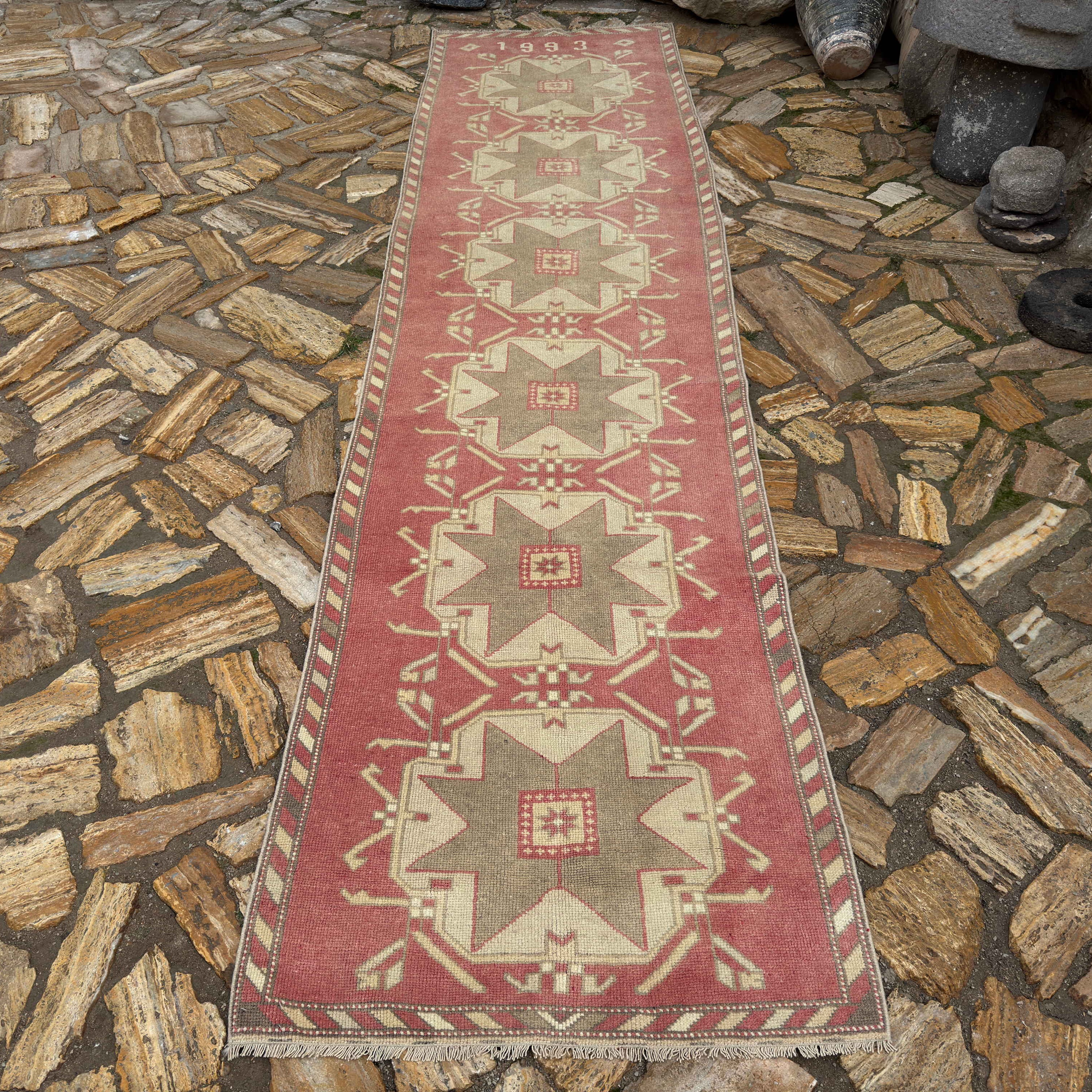 Pale Red 3' x 12' vintage Turkish runner carpet in wool and cotton, shown on the floor.