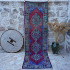 Red 3' x 10' vintage runner rug with traditional design, handmade in Turkey – Elsi.