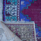 1970s red vintage Turkish runner rug with traditional design, hand-knotted weave and low pile.