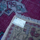 Red 3' x 10' vintage Turkish runner rug from the 1970s with traditional design.