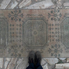 1970s beige vintage Turkish runner rug with traditional design, hand-knotted weave and low pile.