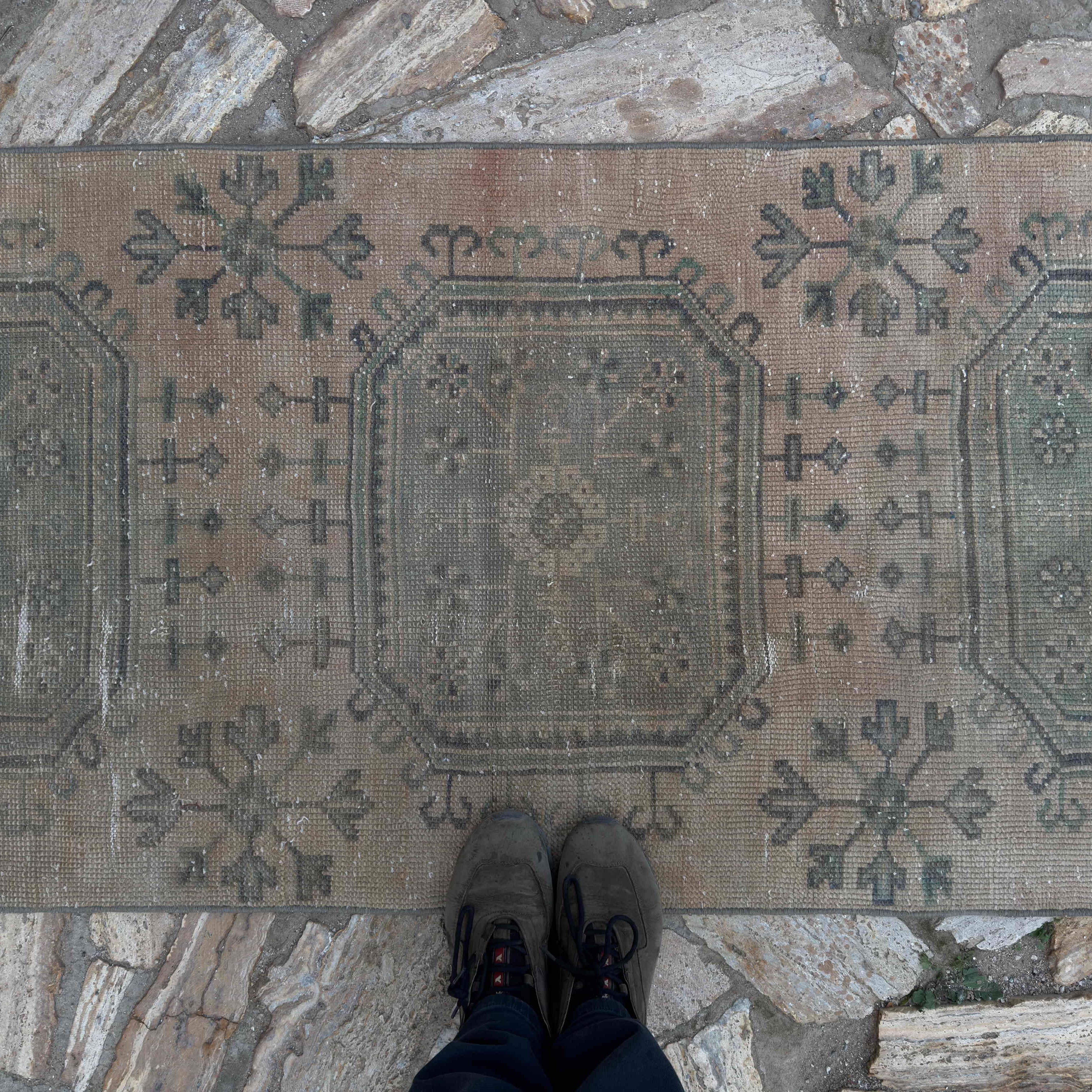 1970s beige vintage Turkish runner rug with traditional design, hand-knotted weave and low pile.