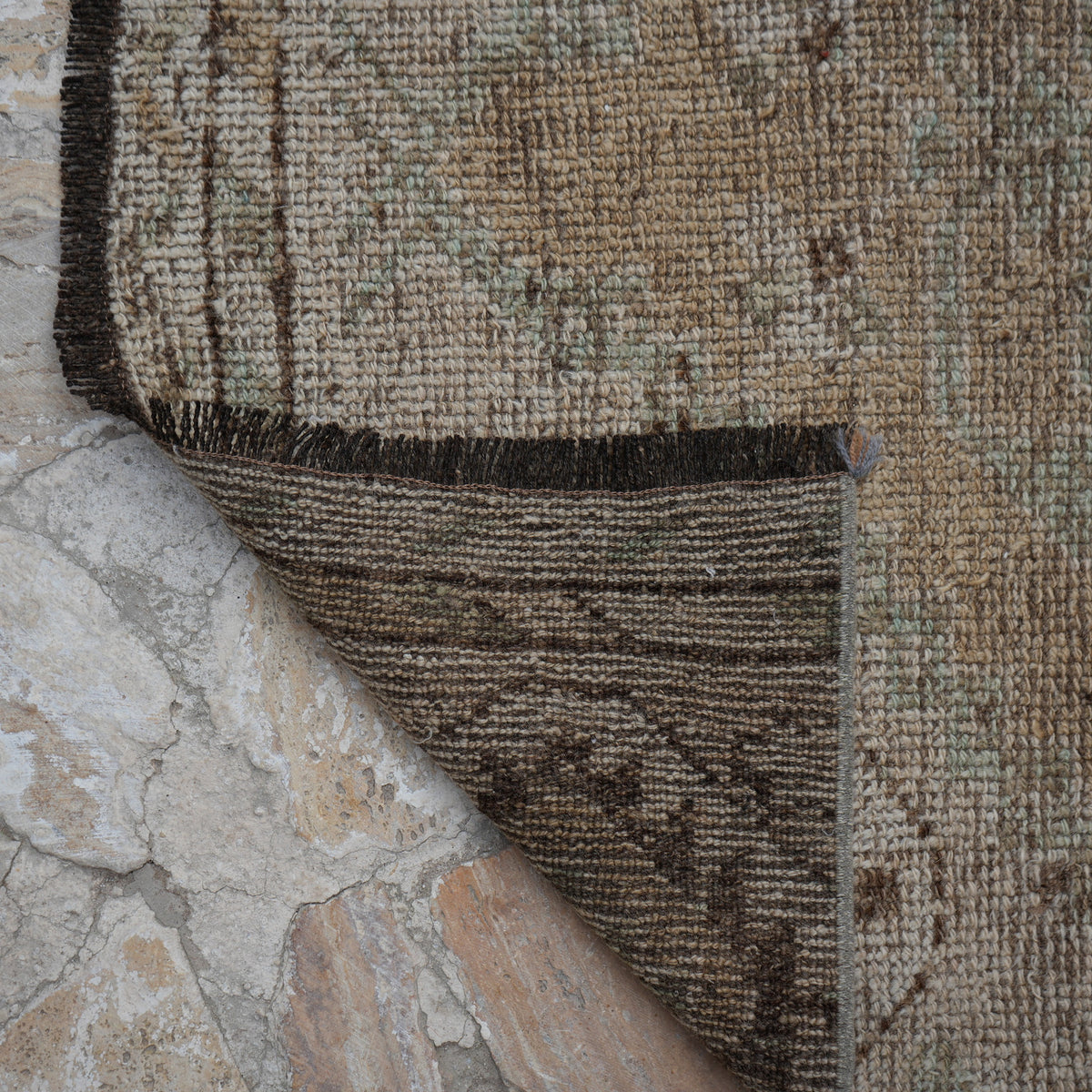 1970s beige vintage Turkish runner rug with neutral design, hand-knotted weave and low pile.