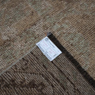 Beige 3' x 11' vintage Turkish runner rug from the 1970s with neutral design.