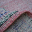 Additional view of the pink vintage Turkish runner rug, hand-knotted in wool and cotton.