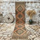 Orange 3' x 13' vintage runner rug with geometric design, handmade in Turkey – Emerson.