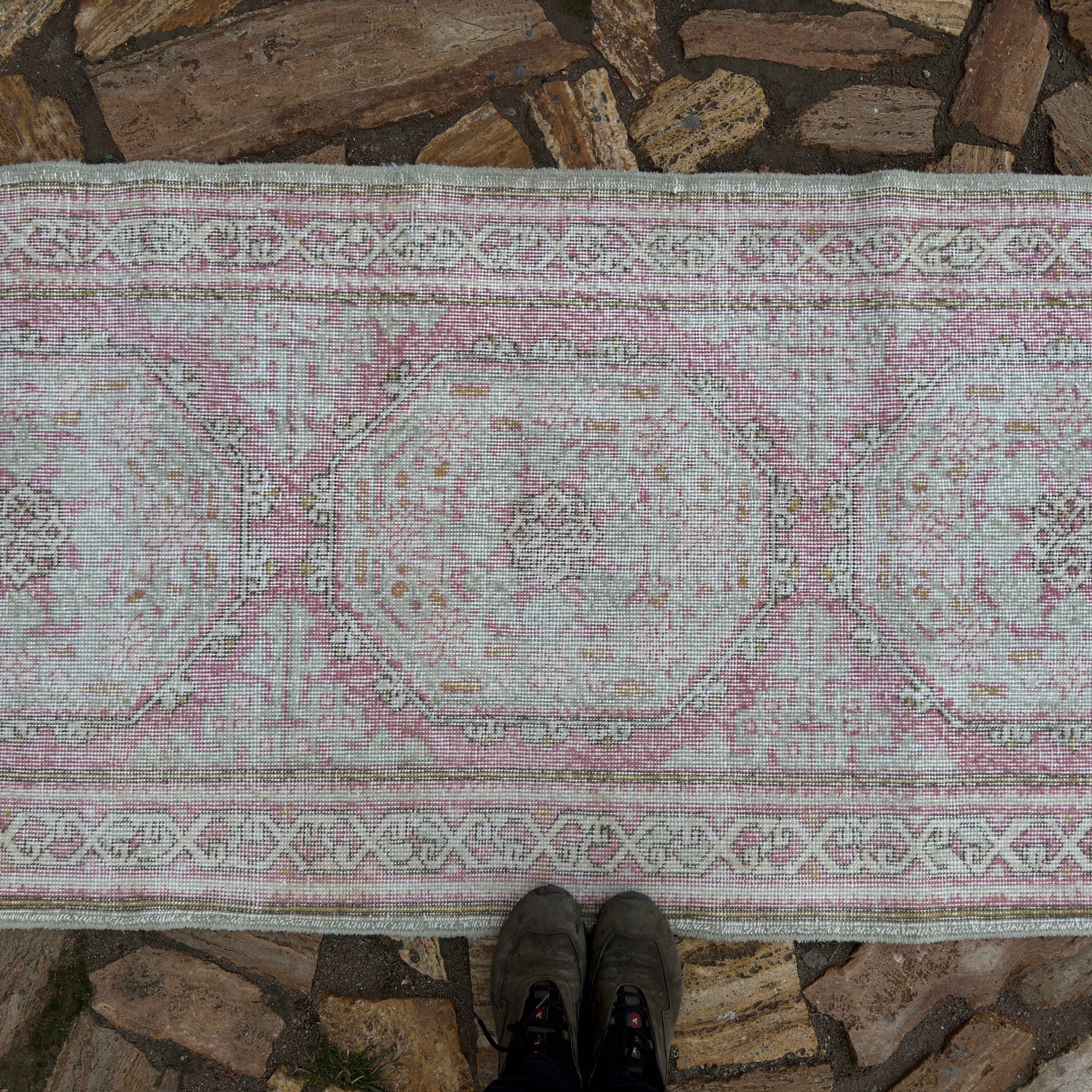 1970s pale pink vintage Turkish runner rug with neutral design, hand-knotted weave and low pile.