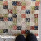Close-up of the beige vintage Turkish runner rug showing traditional details, hand-knotted weave, wool and cotton and low pile.