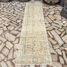 Beige 3' x 9' vintage Turkish runner rug in wool and cotton, shown on the floor.
