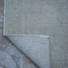 1970s pink vintage Turkish runner rug with traditional design, hand-knotted weave and low pile.
