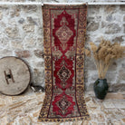 Red 3' x 9' vintage runner rug with traditional design, handmade in Turkey – Lindy.