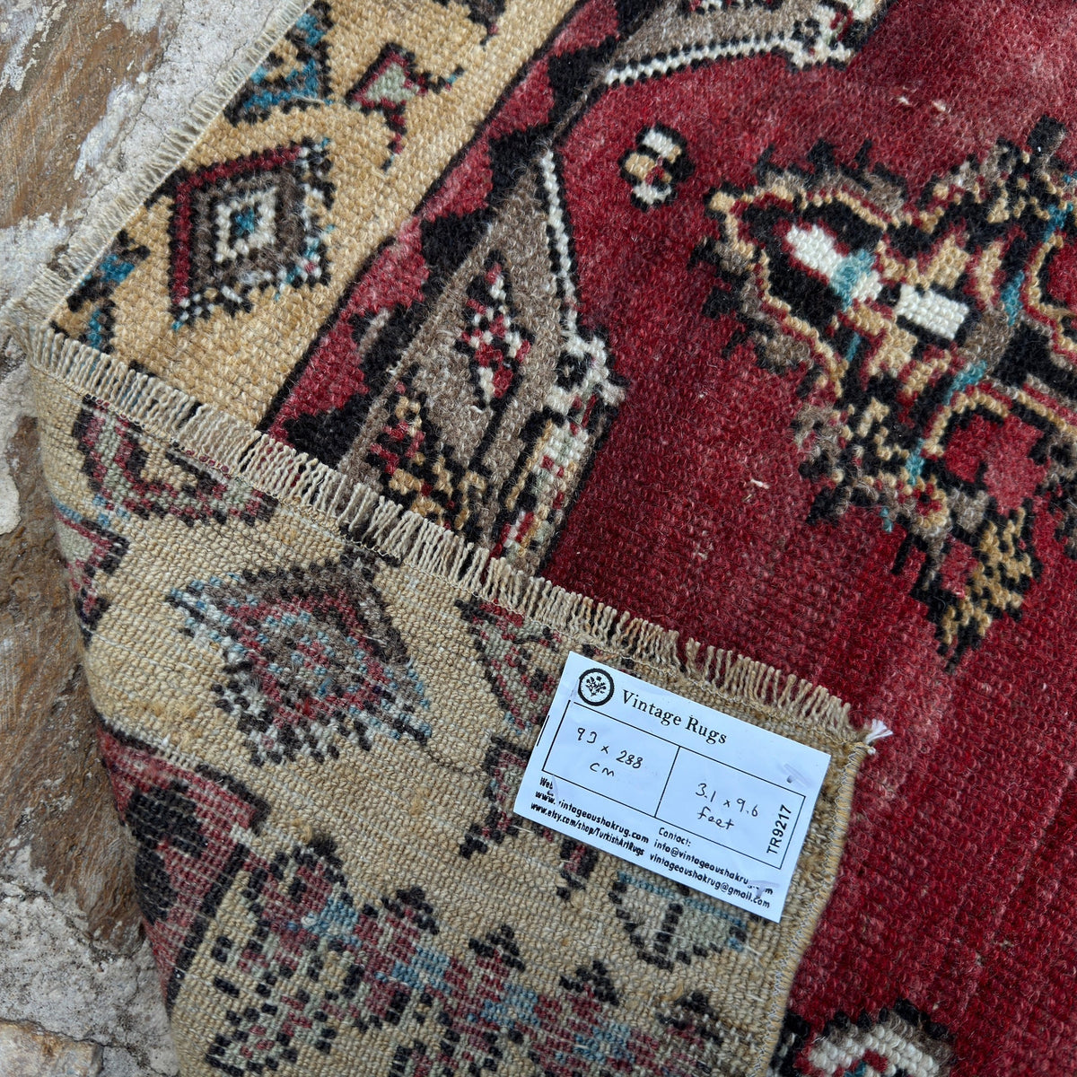 1970s red vintage Turkish runner rug with traditional design, hand-knotted weave and low pile.