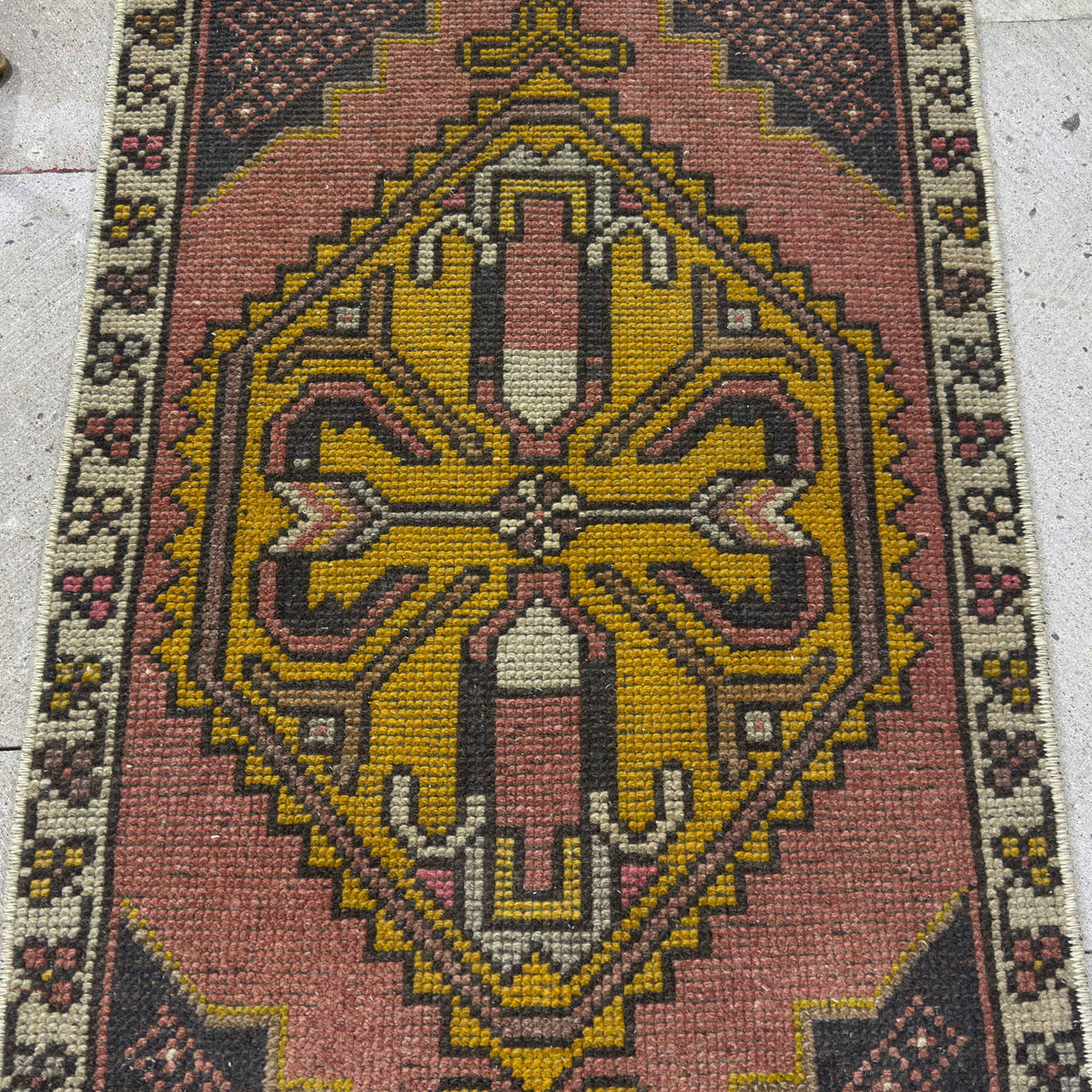 1970s pink vintage Turkish small carpet with traditional design, hand-knotted weave and low pile.