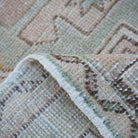 Additional view of the pink vintage Turkish small rug, hand-knotted in wool and cotton.