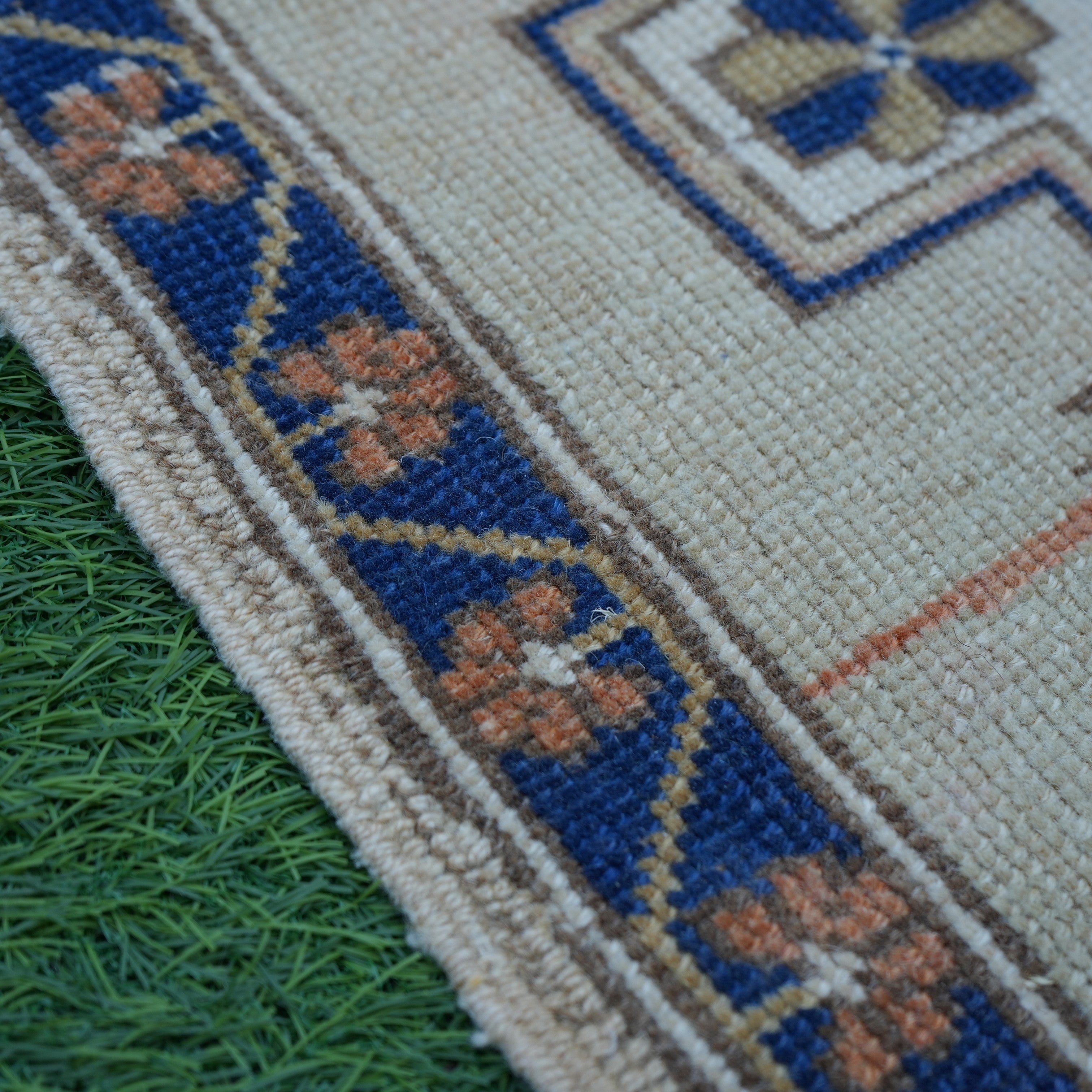 Blue 2' x 2' vintage Turkish square rug in wool and cotton, shown on the floor.