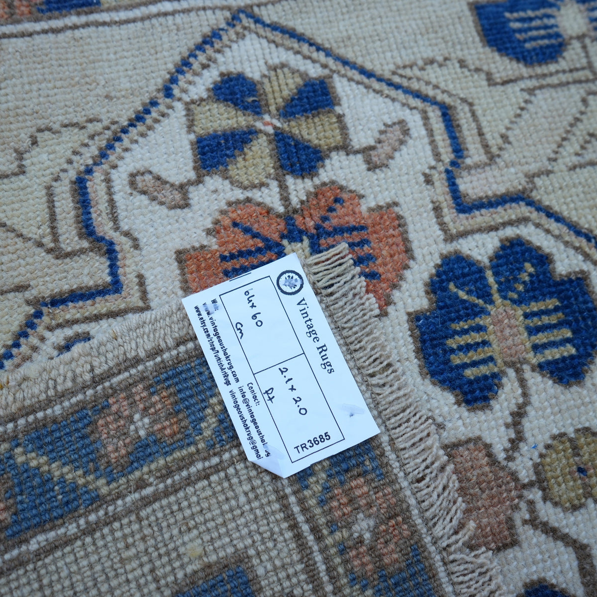 Blue 2' x 2' vintage Turkish square rug from the 1970s with traditional design.