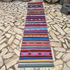 Pink 3' x 11' vintage Turkish striped runner rug in wool and cotton, shown on the floor.