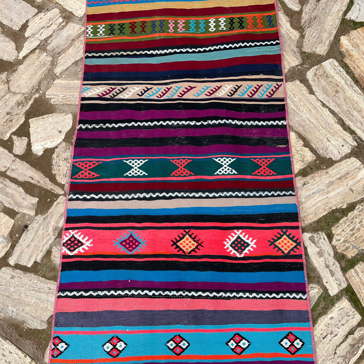 1970s pink vintage Turkish striped runner rug with striped design, flatweave construction and low pile.