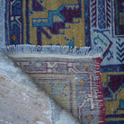 1970s blue vintage Turkish tradiitonal rug with traditional design, hand-knotted weave and low pile.