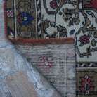 1970s red vintage Turkish tradiitonal rug with traditional design, hand-knotted weave and low pile.