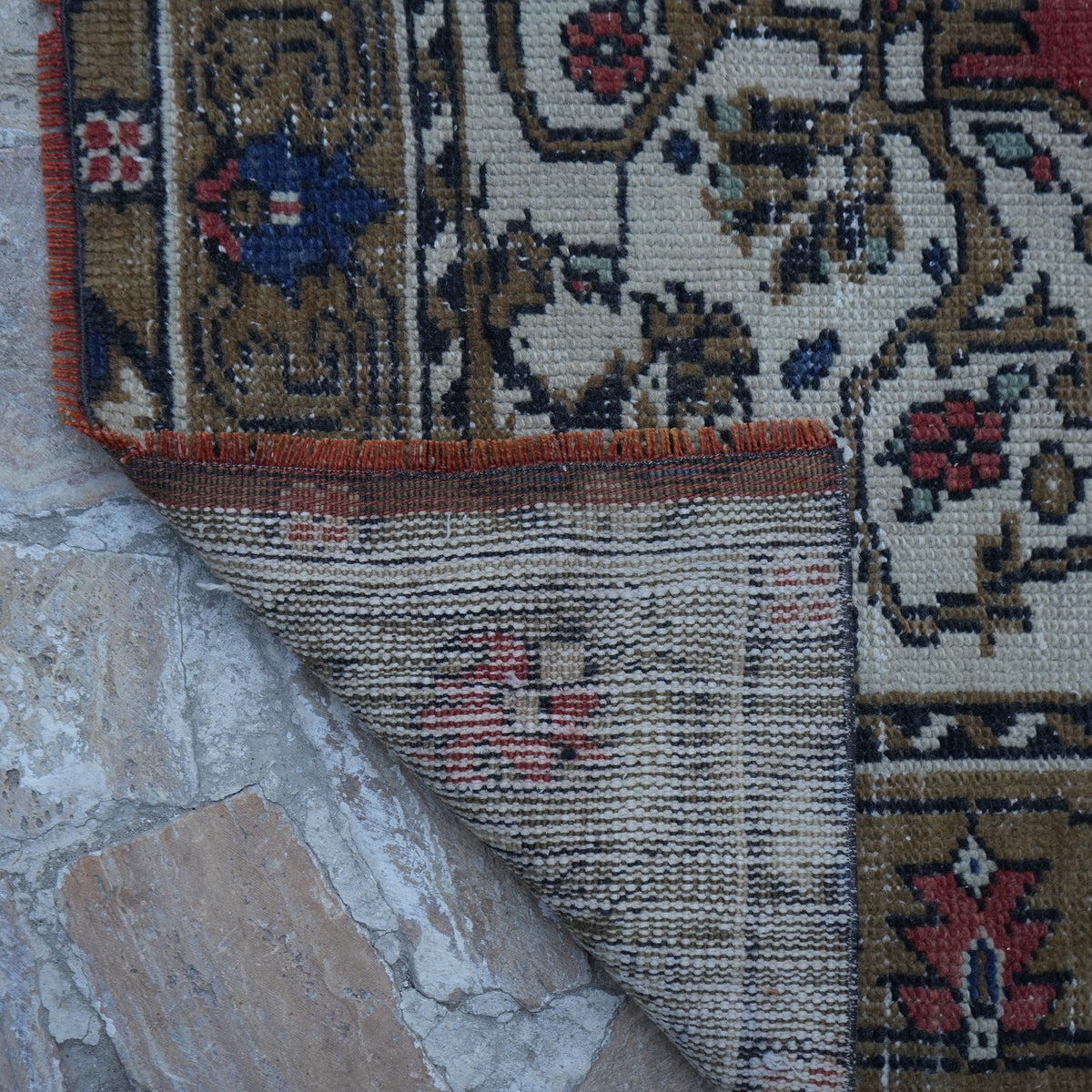 1970s red vintage Turkish tradiitonal rug with traditional design, hand-knotted weave and low pile.